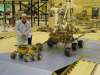 Mars rovers next to a human